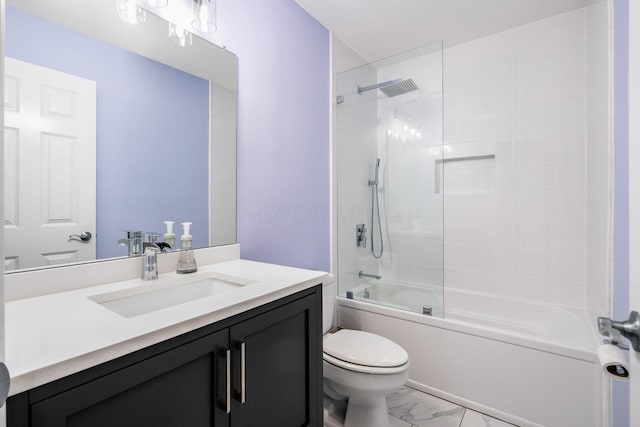 bathroom featuring bathing tub / shower combination, toilet, marble finish floor, and vanity