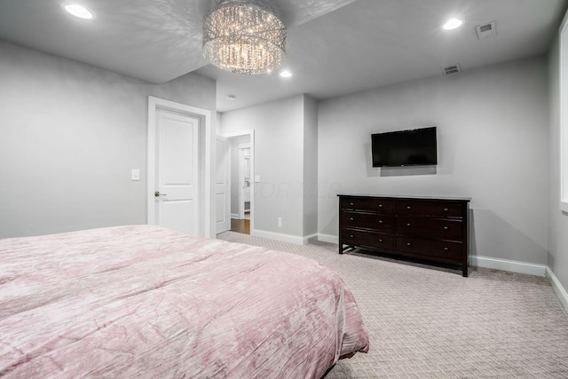 carpeted bedroom featuring recessed lighting, visible vents, baseboards, and a chandelier