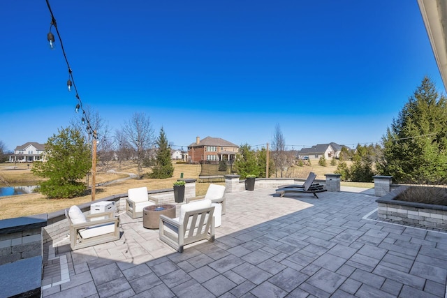 view of patio / terrace with an outdoor fire pit