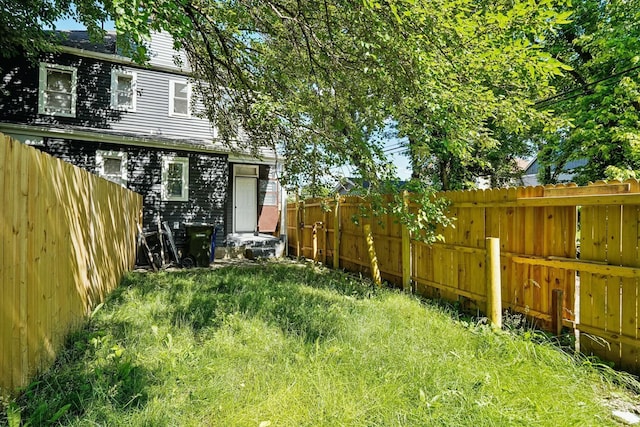 view of yard with a fenced backyard