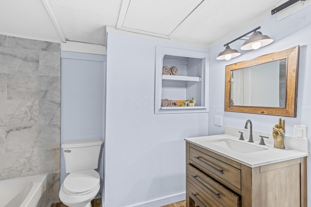 bathroom featuring toilet and vanity