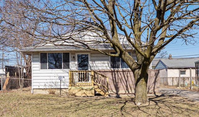 view of front of house with fence