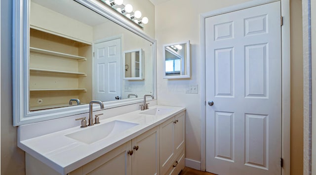 full bath featuring a sink and double vanity