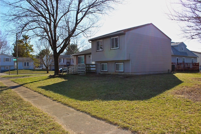 view of home's exterior featuring a yard