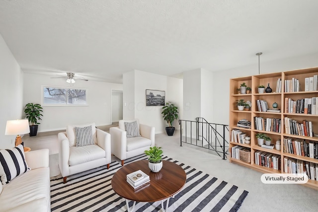 living area featuring a ceiling fan