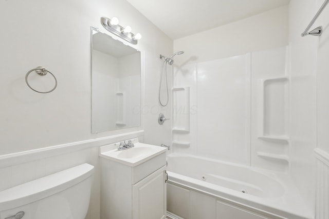 bathroom with toilet, vanity, and a combined bath / shower with jetted tub