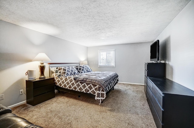 carpeted bedroom with a textured ceiling and baseboards