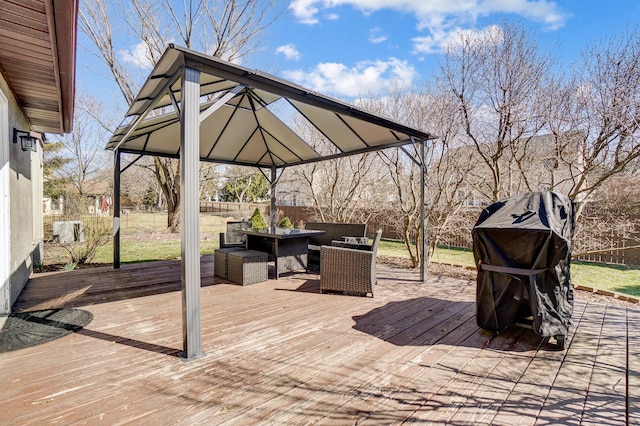 wooden deck with a gazebo, outdoor lounge area, and fence