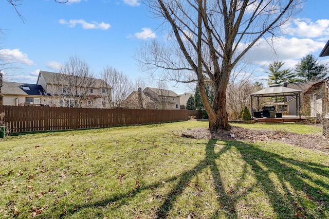 view of yard featuring a gazebo, a deck, and fence