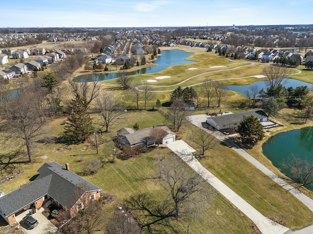 bird's eye view with a residential view and a water view