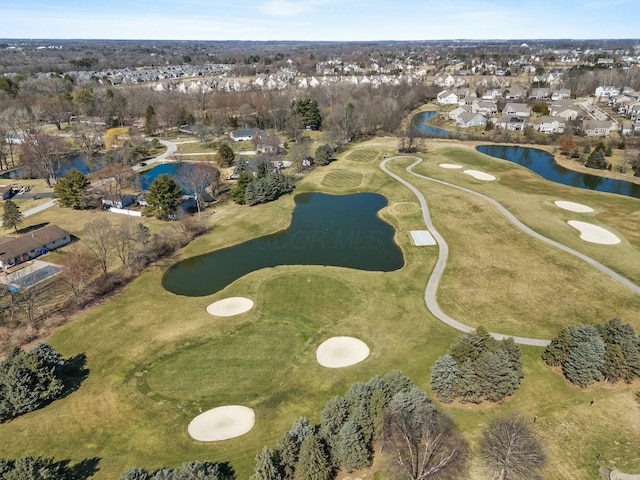 birds eye view of property with a residential view, a water view, and view of golf course