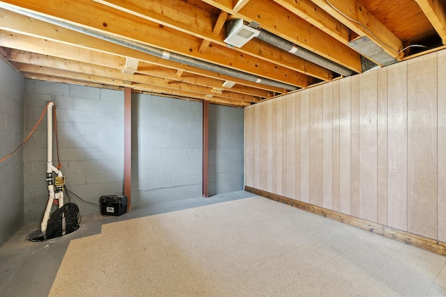 unfinished below grade area with tile patterned floors and visible vents