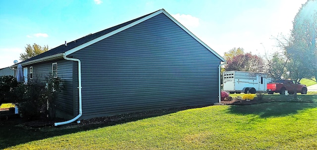 view of property exterior with a yard