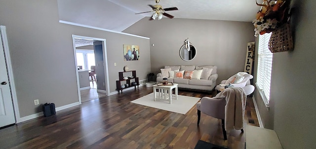 living room with baseboards, wood finished floors, and a ceiling fan