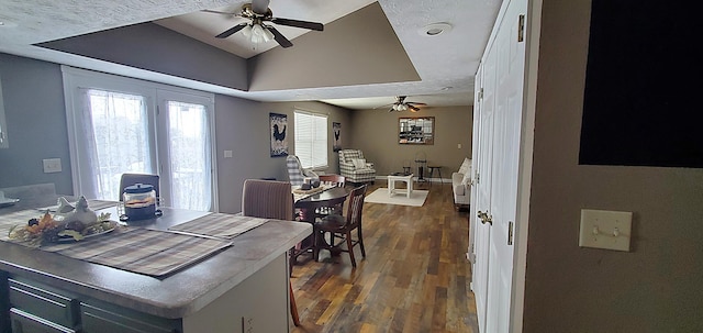 dining area with dark wood-style floors and a ceiling fan