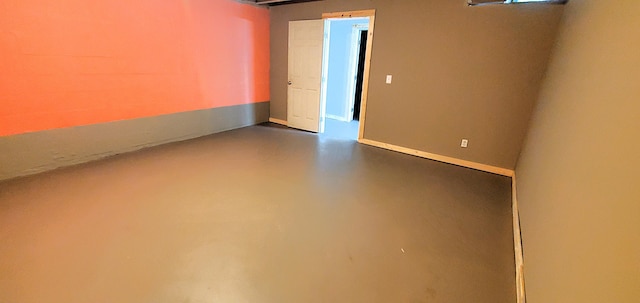 empty room with concrete flooring