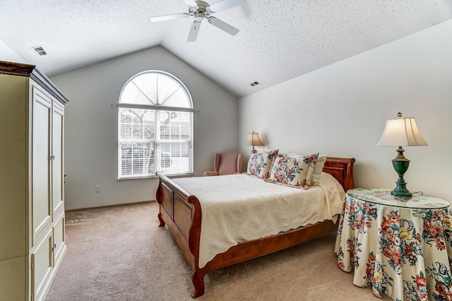 bedroom featuring a textured ceiling, lofted ceiling, visible vents, and light carpet