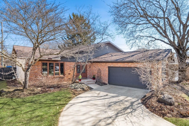 view of front facade with concrete driveway, an attached garage, brick siding, and roof with shingles