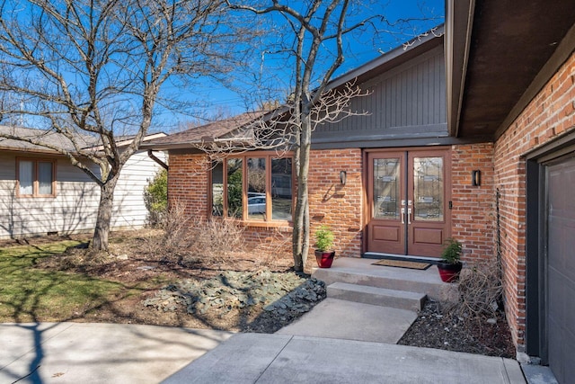 property entrance with brick siding and board and batten siding