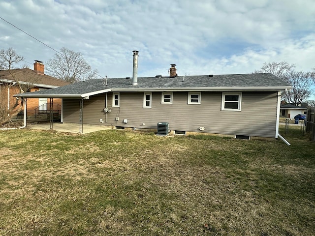 rear view of property featuring central air condition unit, a patio, a yard, and fence