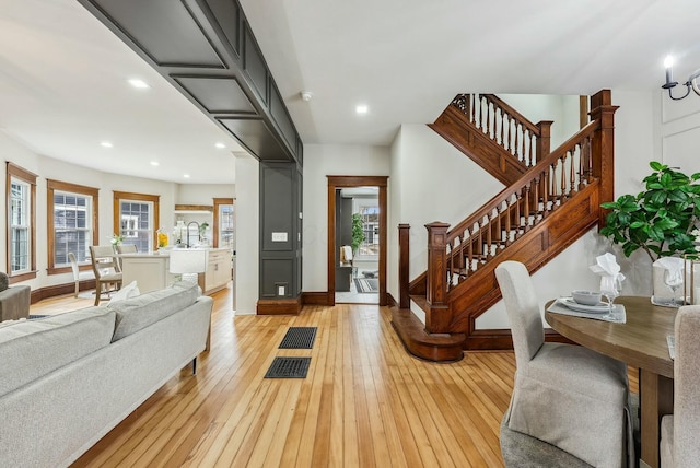 foyer featuring stairway, recessed lighting, light wood-type flooring, and baseboards