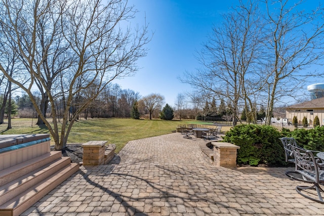 view of patio featuring a covered hot tub