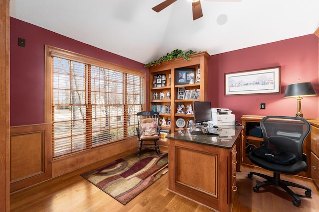 office space featuring light wood finished floors, a ceiling fan, and vaulted ceiling