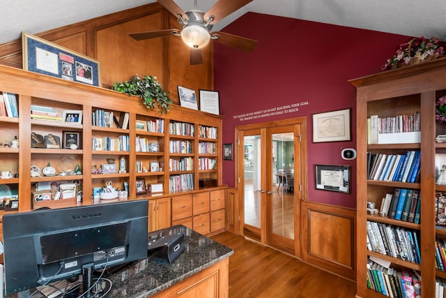 office featuring french doors, a ceiling fan, lofted ceiling, and wood finished floors