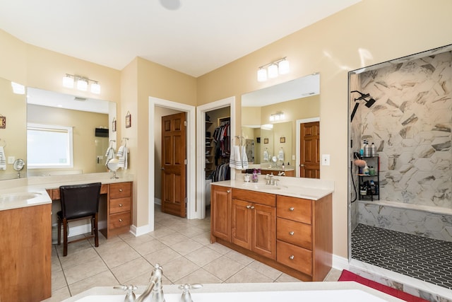 full bath featuring vanity, a tile shower, tile patterned flooring, a walk in closet, and a washtub