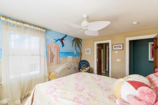 bedroom featuring a ceiling fan and baseboards