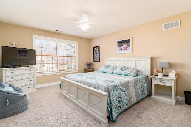 bedroom with a ceiling fan, carpet, visible vents, and baseboards