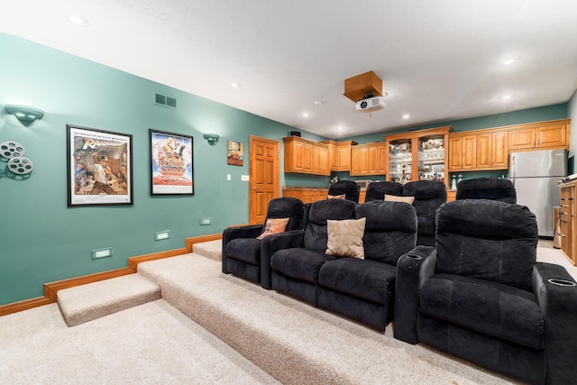 cinema room featuring recessed lighting, visible vents, baseboards, and light colored carpet