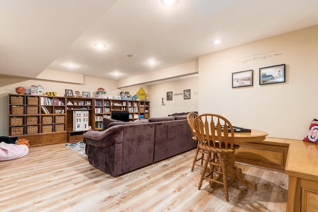 living area featuring recessed lighting and light wood-style flooring