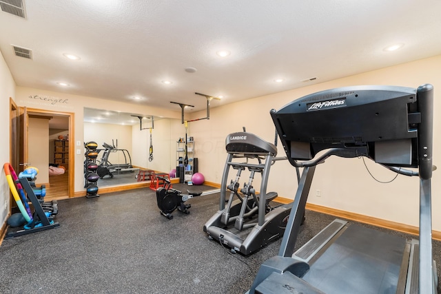 workout area featuring recessed lighting, baseboards, and visible vents