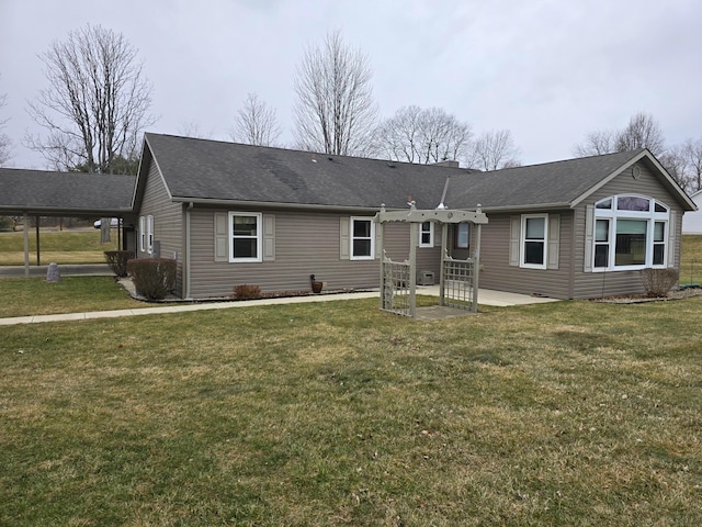 view of front facade with a front lawn and a patio area