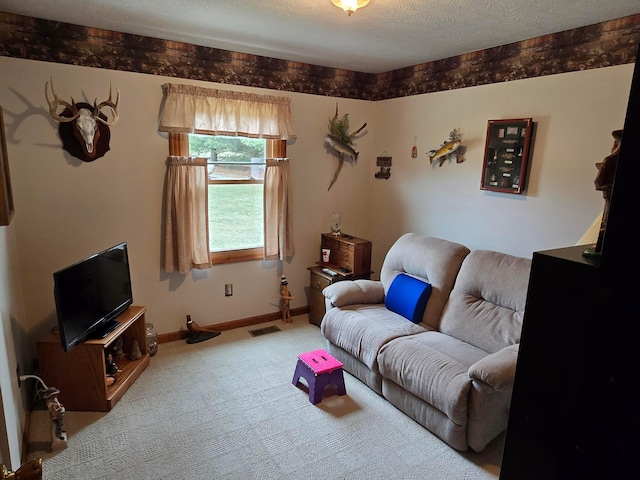 carpeted living area with visible vents, baseboards, and a textured ceiling