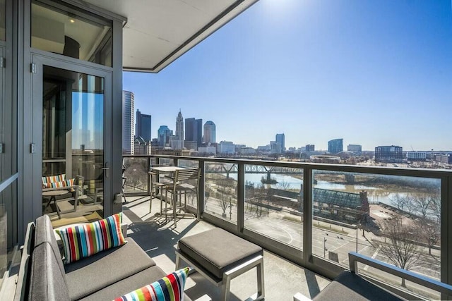 balcony with a city view and a water view