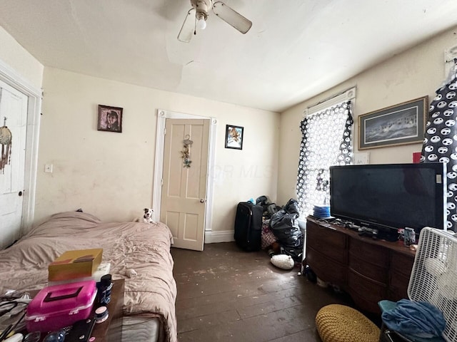 bedroom with a ceiling fan and wood-type flooring