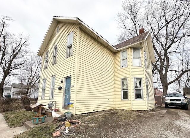 view of home's exterior featuring a chimney