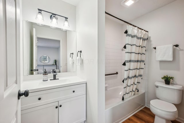 bathroom featuring wood finished floors, toilet, vanity, and shower / bathtub combination with curtain