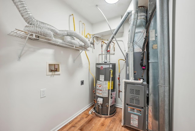 utility room featuring gas water heater