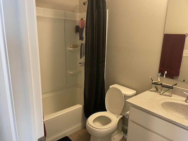 bathroom with shower / tub combo, toilet, and vanity