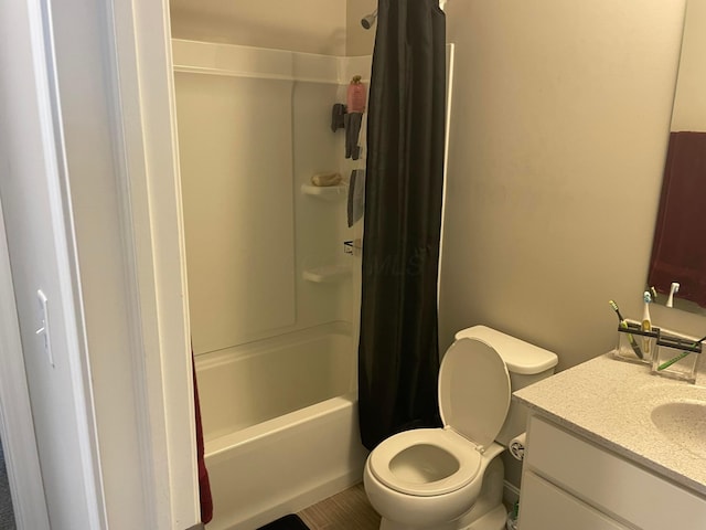 bathroom featuring toilet, vanity, and shower / bath combo