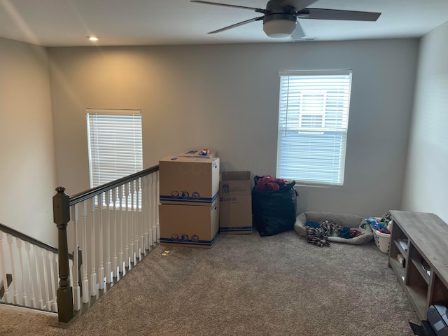 interior space featuring recessed lighting, a ceiling fan, and carpet flooring