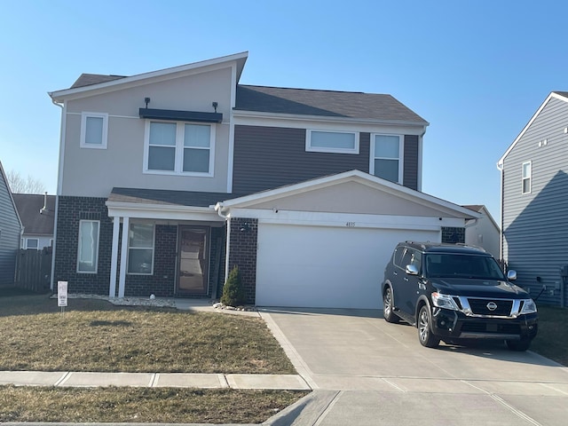 view of front of house with brick siding, driveway, and a garage