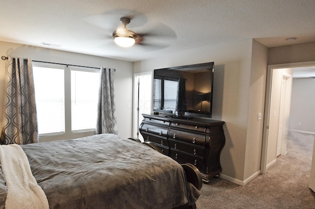 4835 Amber Crossing Dr, Columbus, OH 43232 - bedroom with baseboards, carpet floors, a textured ceiling, and a ceiling fan