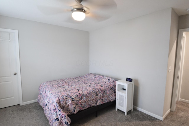 4835 Amber Crossing Dr, Columbus, OH 43232 - bedroom with baseboards, a ceiling fan, and carpet