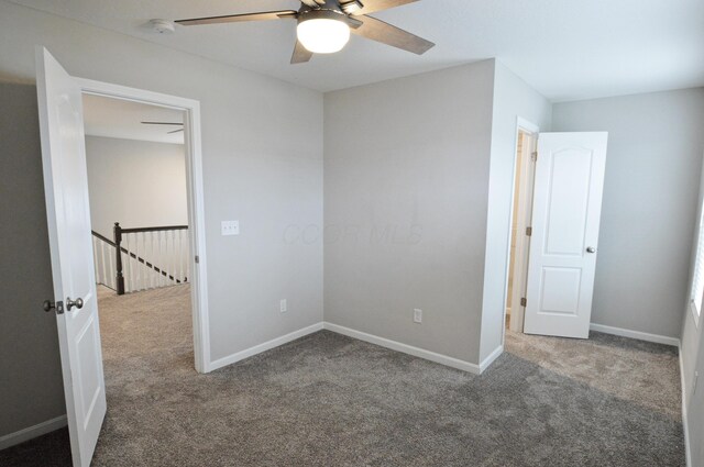 4835 Amber Crossing Dr, Columbus, OH 43232 - unfurnished bedroom with carpet, baseboards, and ceiling fan
