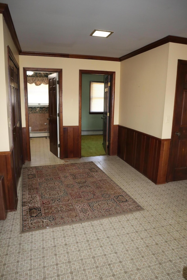 hallway with wood walls and wainscoting