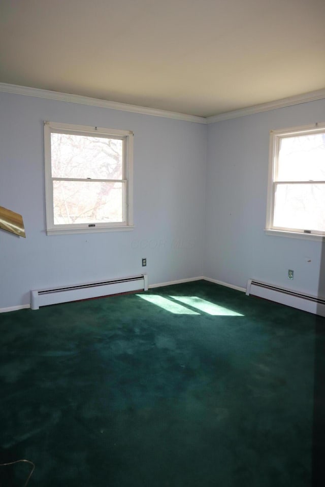 carpeted spare room featuring crown molding, baseboards, and a baseboard radiator